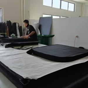 Home 40 Technician assembling Aluminum Honeycomb base for hard shell roof tents. Heavy Duty manufacturing standards ensuring durability.