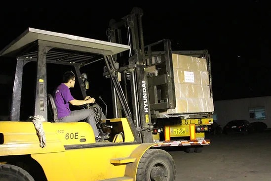 The Definitive Guide to B2B Rooftop Tent Sourcing: Your ISO 9001 Certified Manufacturing Partner 6 Night shift forklift operation loading CAMP AUTO PARTS products into shipping container for export.