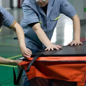 Home 45 Workers performing final assembly of Hard Shell roof tents. Strict Quality Control before packaging for export.