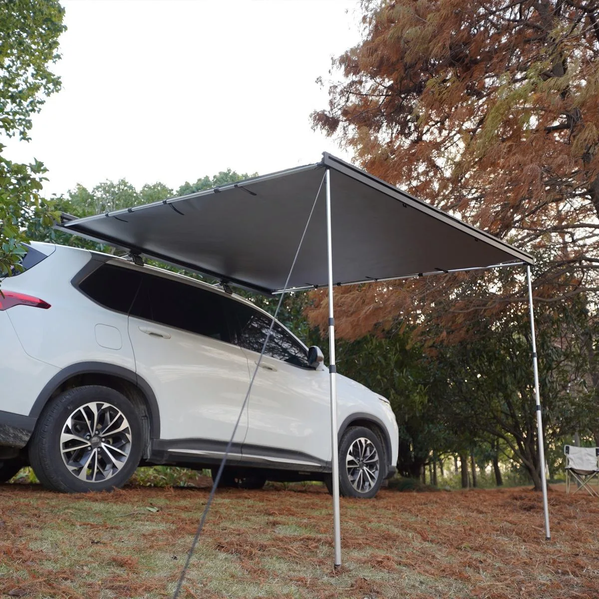 Deployed Rectangular (90-degree) side awning providing large shade area. Waterproof & Wind Resistant fabric with telescopic poles for Family Camping.