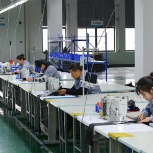 Busy sewing workshop with multiple production lines. High Manufacturing Capacity for Bulk Order fulfillment of roof top tents.