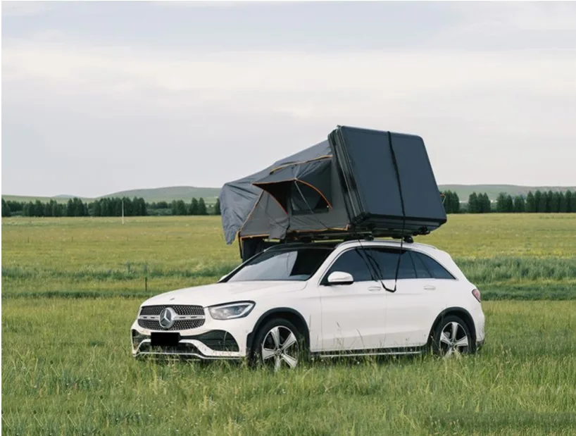 Side profile of Aluminum Hard Shell tent on Mercedes. Sleek design matching luxury vehicles, available for Bulk Order.