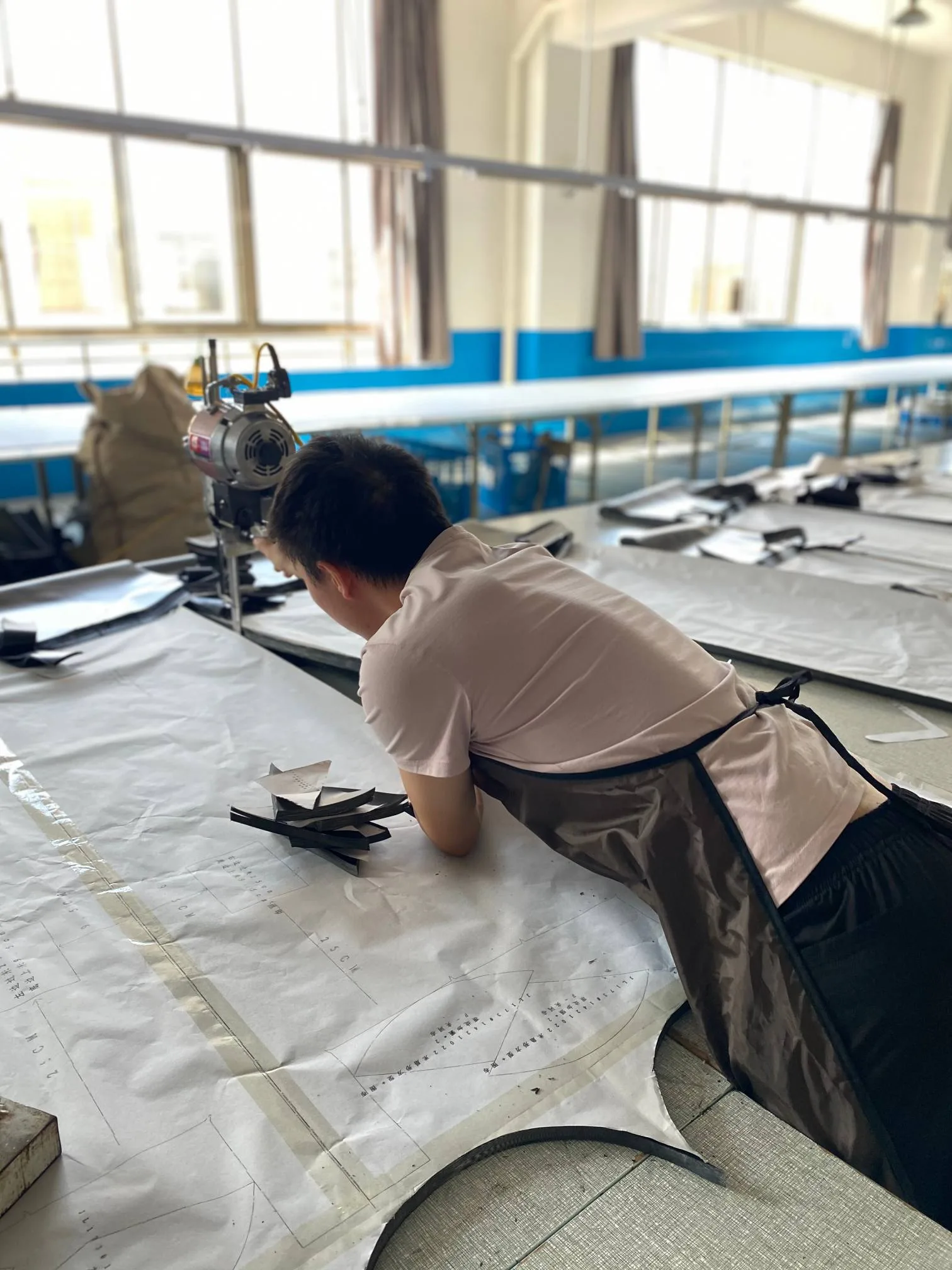 Waterproof seam sealing and fabric cutting stations. Ensuring Waterproof & Wind Resistant quality for global Outdoor Gear brands.