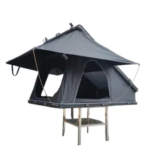 Detail view of water tank mounting system on the rear accessory channel of an aluminum clamshell roof top tent. Space-saving design.